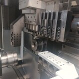 Tornio a fantina mobile a 5 assi Cnc